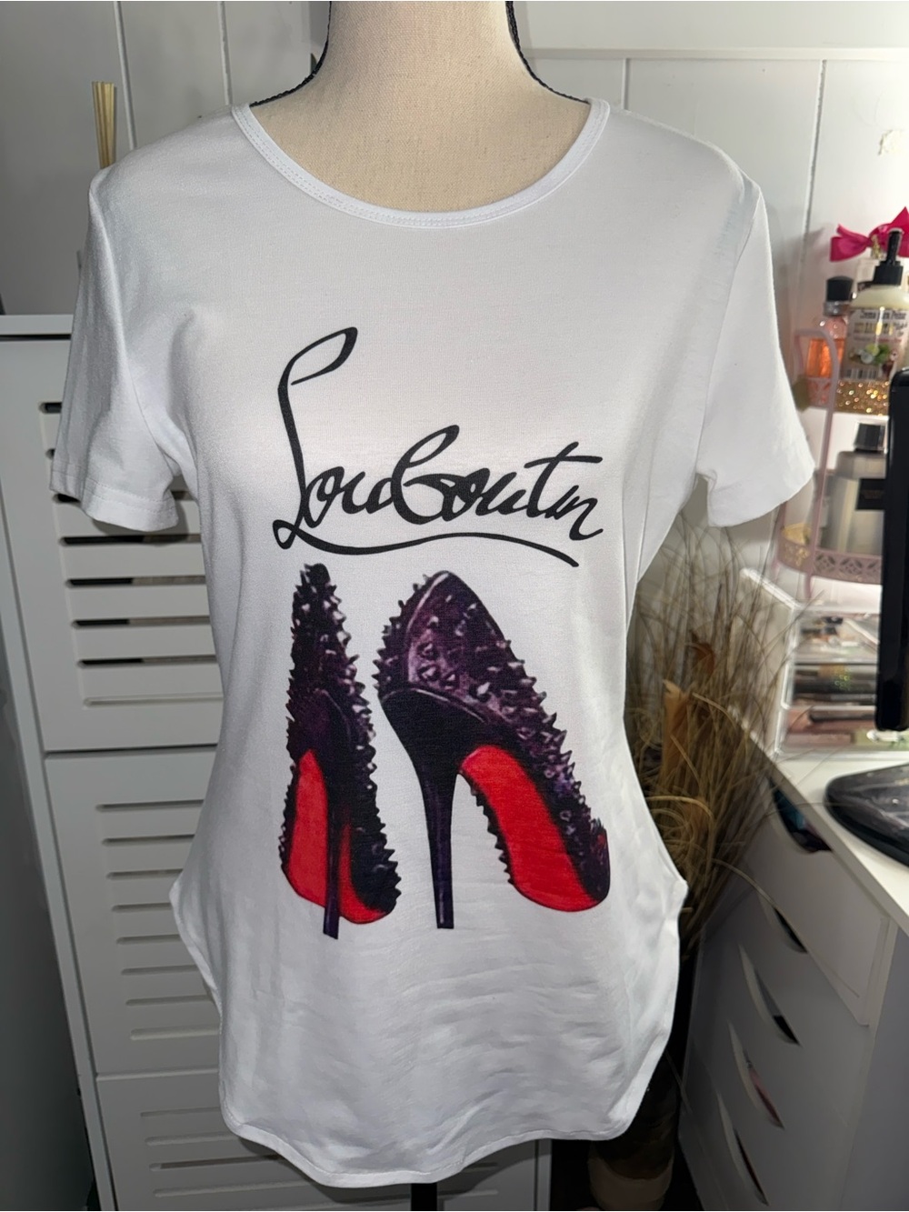 White Graphic Tee with Black Script and Red-Soled Heel Print